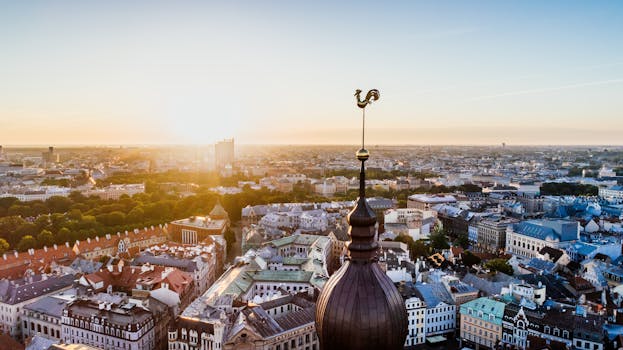 pexels-photo-681405-681405 Stunning aerial view of Riga, Latvia with the sun rising over the historic cityscape and skyline.